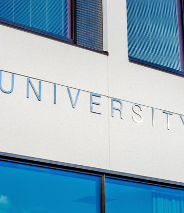 Supply Chain Scene, image of a building front engraved "University" 