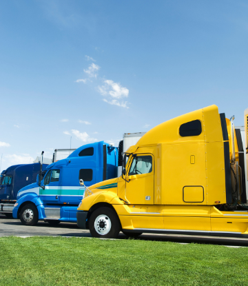 Image of two 18-wheel truck cabs, side by side 