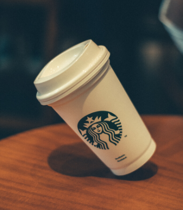 SCS, image of a starbucks coffee cup with lid and logo 