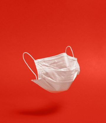 SCS, image of a white face mask against a red background 