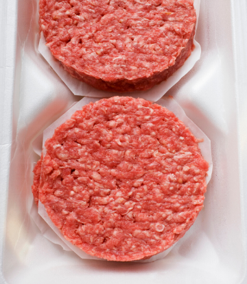 SCSm image of pre-formed hamburger patties in a foam tray 