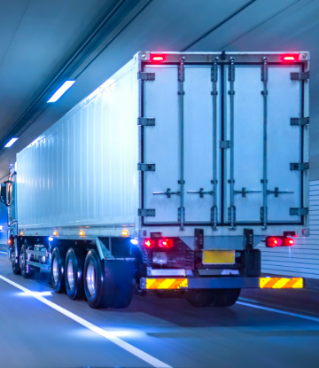 image of a truck driving through a highway tunnel 