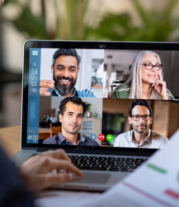 Image of a video conference call with 4 people on a laptop 