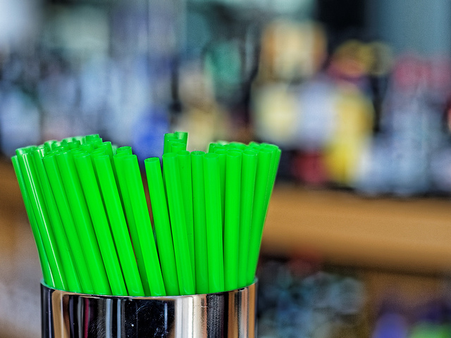 Green straws in a silver container
