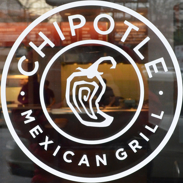 Chipotle logo on glass door