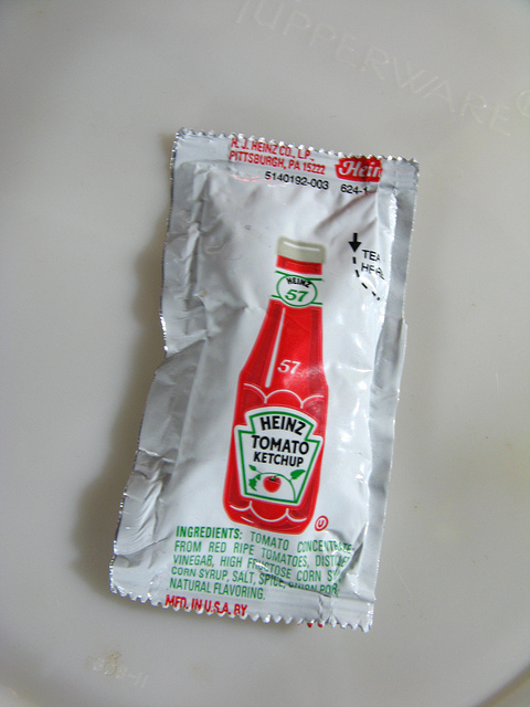 1 Heinz ketchup packet against white background