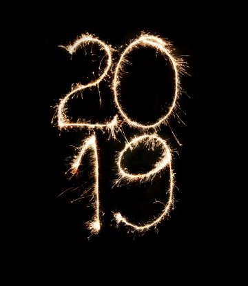 Sparklers that spell 2019 against black background.