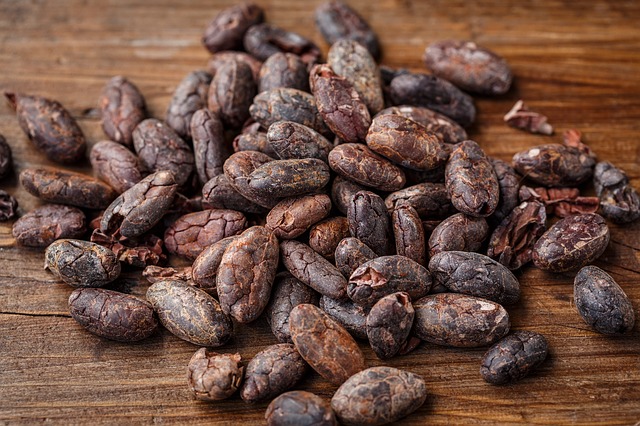 Cocoa beans on wooden table