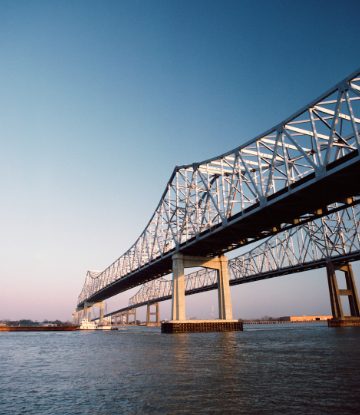 Supply Chain Scene, image of a bridge over high river water 