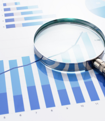 Supply Chain Scene, image of a sales trend chart with a magnifying glass 