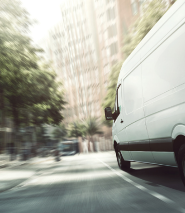 Supply Chain Scene, image of a blurry, fast moving delivery vehicle 