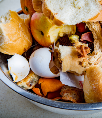 Supply Chain Scene, image of a trash can with food scraps