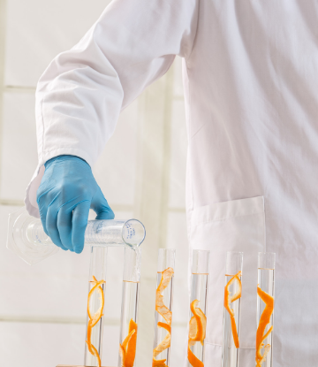 Supply Chain Scene, ominous image of a lab technician adding to test tubes
