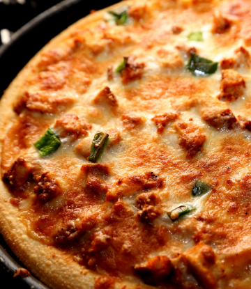 Supply Chain Scene, closeup image of a baked, round pizza 