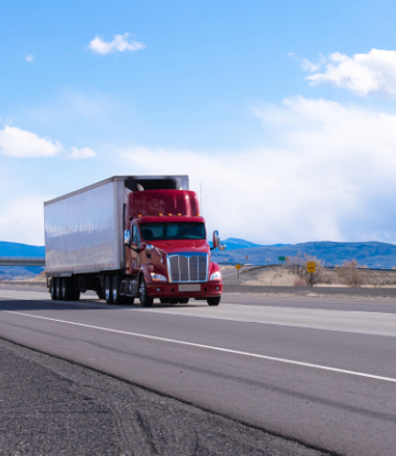 Supply Chain Scene, image of an 18 wheeler truck on the highway