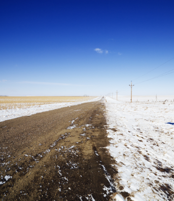 SCS, image of snowy crop fields on a rural road 