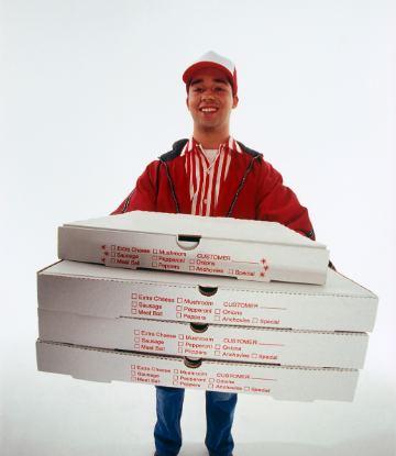 SCS, image of a pizza delivery person holding a stack of pizza boxes 