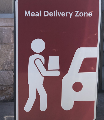 SCS, image of a sign that says "Meal Delivery Zone" 