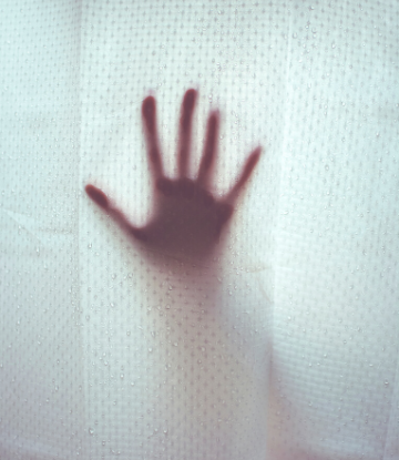 SCS, ghostly image of a hand against a clear shower curtain 