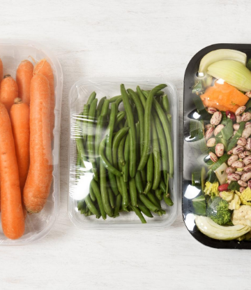 Image of food in plastic containers with plastic film covering 