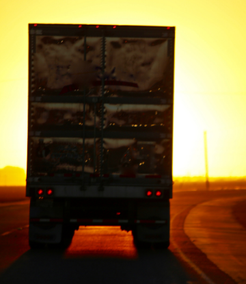 image of a truck drving past roadside fires 