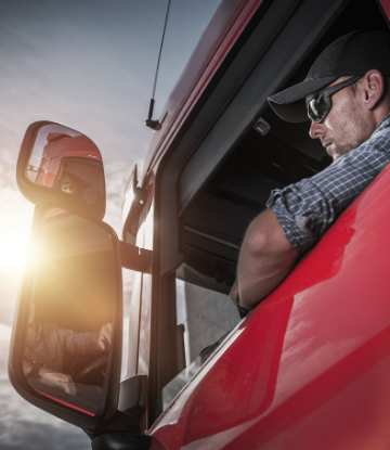 Image of a truck driver in his cab 