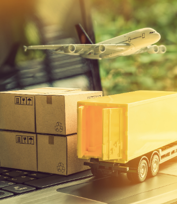 Image of a truck, airplane and product boxes superimposed over a laptop computer 