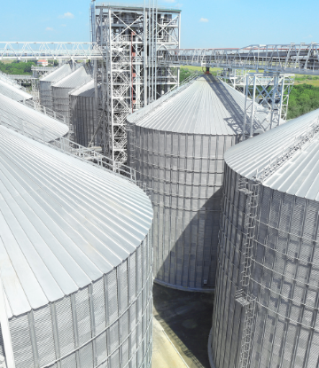 Image of grain storage bins on a farm 