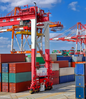 Image of shipping containers at a port wating for loading 