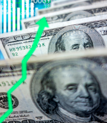 image of $100 bills with a green arrow pointing upward 