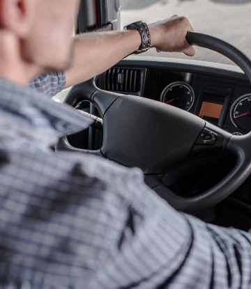 a truck driver behind the wheel