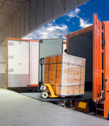 Freight coming off a truck at loading dock