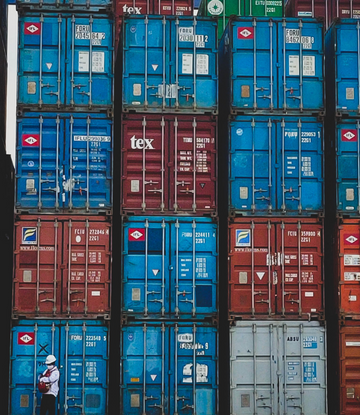 stacked shipping containers at port