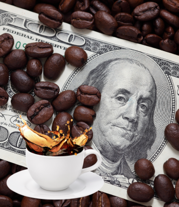 coffee cup with loose change around it