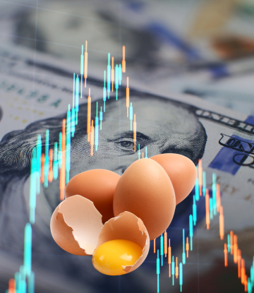 eggs in front of money and market trading symbol
